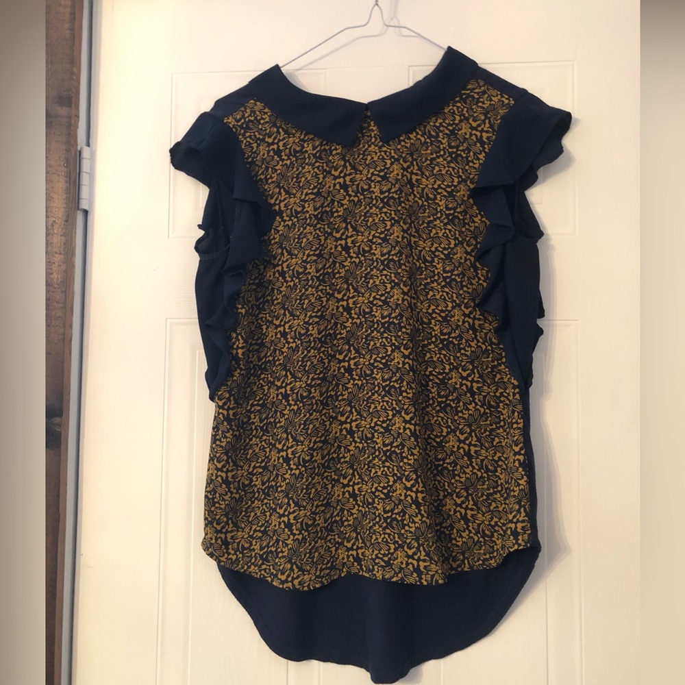 Vibrant blue and yellow flowered sleeveless blouse